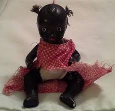 A doll similar to the one I bought only to test the depth of the prejudice of my Uncle John. Mine did not have a dress.