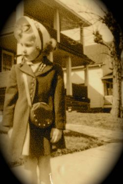 On my way to Sunday School in Cleveland, age 4 or so. The bag is not a canteen. It's a purse based on canteen design, a military style lingering from World War II.